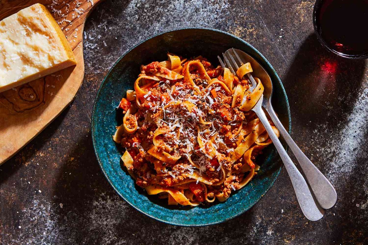 Bowl of tagliatelle with bolognese sauce and parmesan